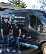 Two Locksmiths stood infront of the NGCL Locksmith van
