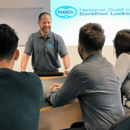 ngcl members sat round table with teacher