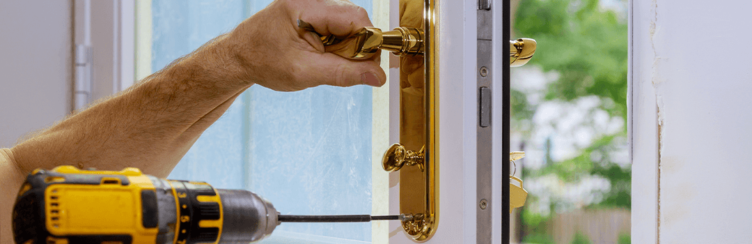 Locksmith Changing Door Lock and handle with power drill