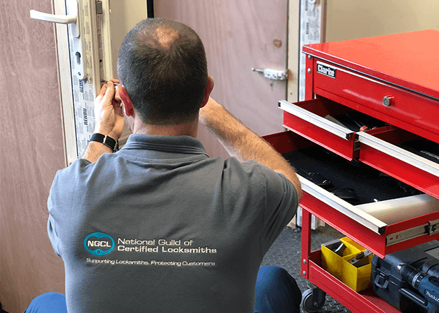 NGCL Locksmith working on door
